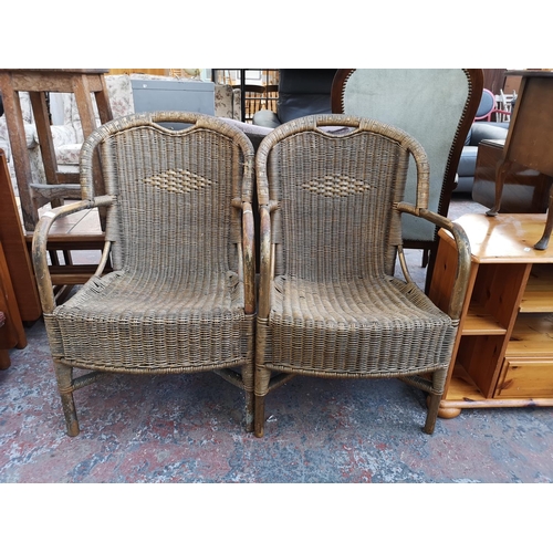 1096 - A pair of vintage gold painted wicker and bamboo armchairs