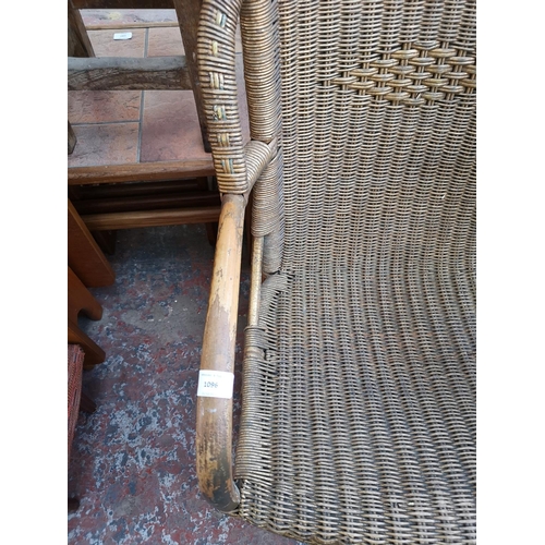 1096 - A pair of vintage gold painted wicker and bamboo armchairs