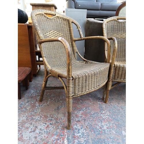 1096 - A pair of vintage gold painted wicker and bamboo armchairs