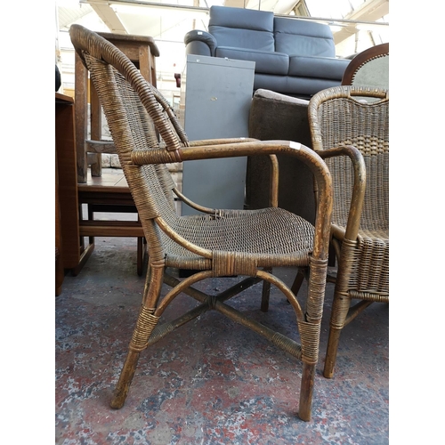 1096 - A pair of vintage gold painted wicker and bamboo armchairs