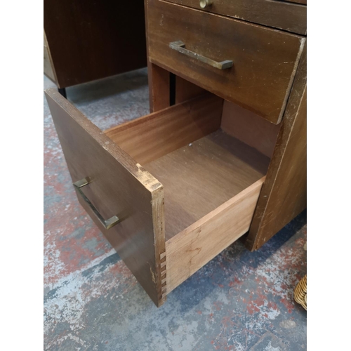 1101 - A mid 20th century Abbess Linear teak office desk - approx. 72cm high x 153cm wide x 76cm deep