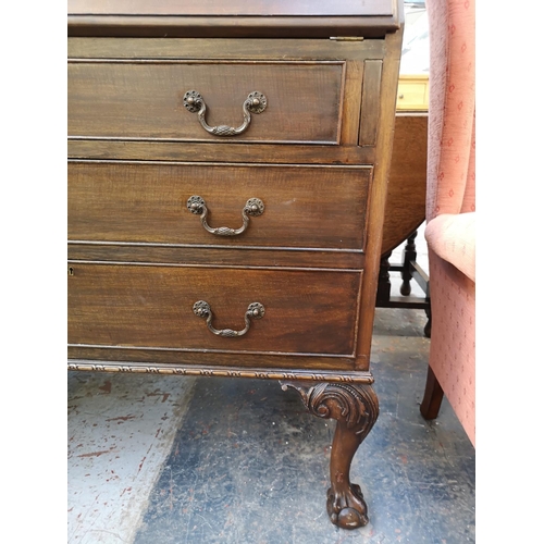 1107 - A Georgian style mahogany bureau bookcase with two upper glazed doors, fall front, three drawers and... 