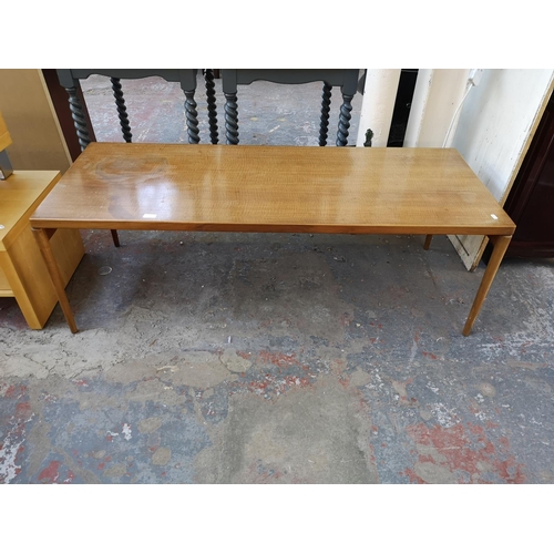 1115 - A mid 20th century walnut rectangular coffee table - approx. 49cm high x 59cm wide x 150cm long