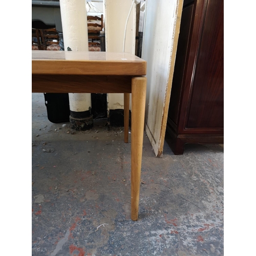 1115 - A mid 20th century walnut rectangular coffee table - approx. 49cm high x 59cm wide x 150cm long