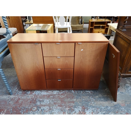 1119 - A Hülsta cherry wood effect sideboard with similar rectangular wall mirror