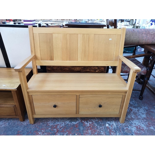 1132 - A modern solid oak monks bench - approx. 98cm high x 110cm wide x 39.5cm deep