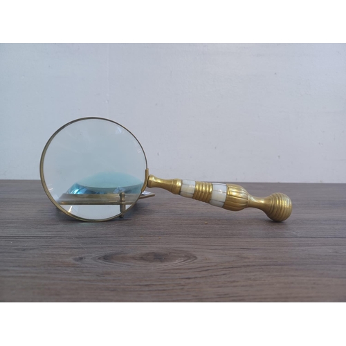 1468 - Two magnifying glasses, one tabletop and one mother of pearl and brass handled