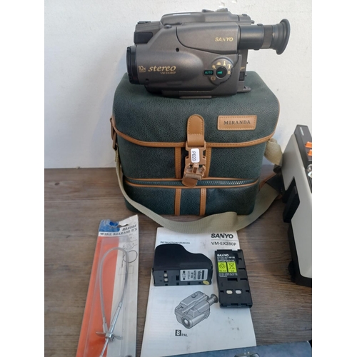 1471 - A collection of items to include cased Sanyo VM-EX280P 8mm video camcorder with accessories and inst... 