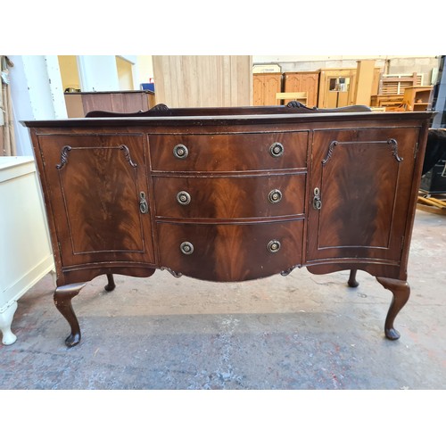 1065C - A Regency style mahogany sideboard with three central drawers and two outer cupboard doors - approx.... 