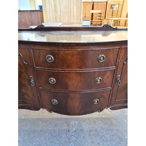 1065C - A Regency style mahogany sideboard with three central drawers and two outer cupboard doors - approx.... 