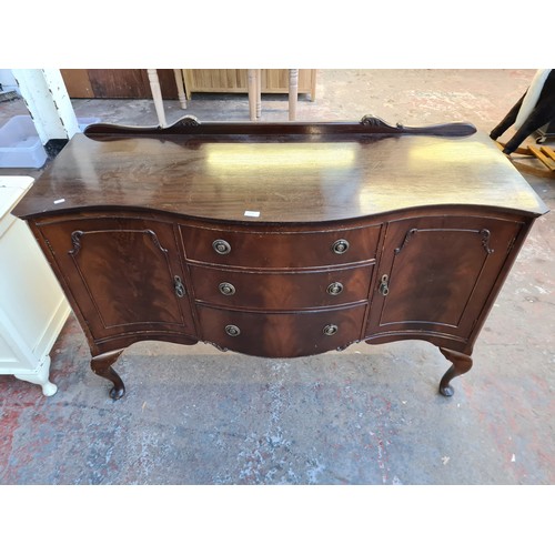 1065C - A Regency style mahogany sideboard with three central drawers and two outer cupboard doors - approx.... 