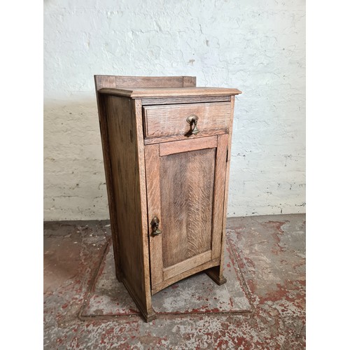 1010A - An early 20th century oak bedside cabinet - approx. 93cm high x 45cm wide x 32cm deep