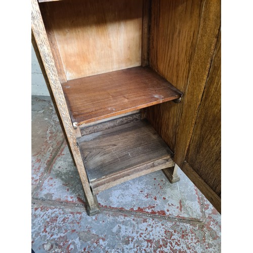 1010A - An early 20th century oak bedside cabinet - approx. 93cm high x 45cm wide x 32cm deep