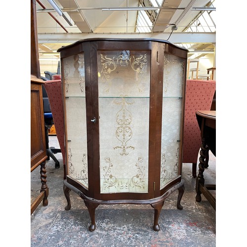 1121 - A mid 20th century walnut display cabinet