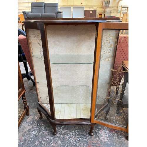 1121 - A mid 20th century walnut display cabinet