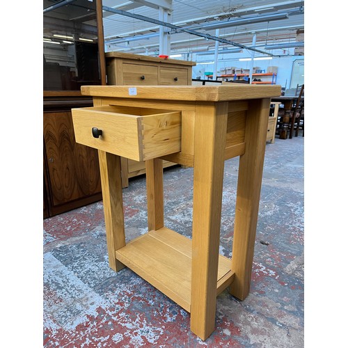 1129 - A modern solid oak single drawer two tier side table - approx. 85.5cm high x 65cm wide x 35cm deep