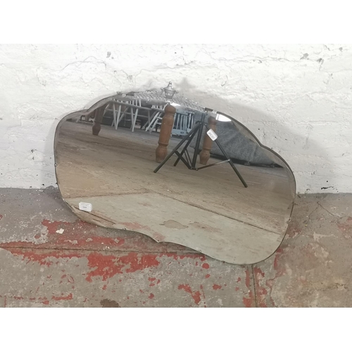 1157 - A mid 20th century bevelled edge frameless wall hanging mirror - approx. 66cm wide x 45cm high