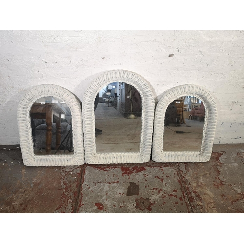 1158 - Three white painted wicker framed wall mirrors - approx. 60cm high x 45cm wide