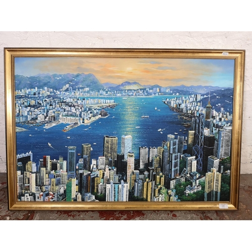 1162 - A gilt framed oil on canvas of a Hong Kong scene - approx. 98cm wide x 67cm high