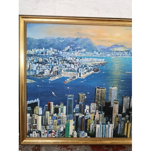 1162 - A gilt framed oil on canvas of a Hong Kong scene - approx. 98cm wide x 67cm high