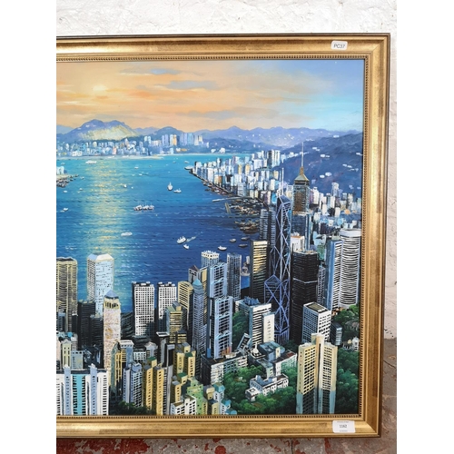 1162 - A gilt framed oil on canvas of a Hong Kong scene - approx. 98cm wide x 67cm high