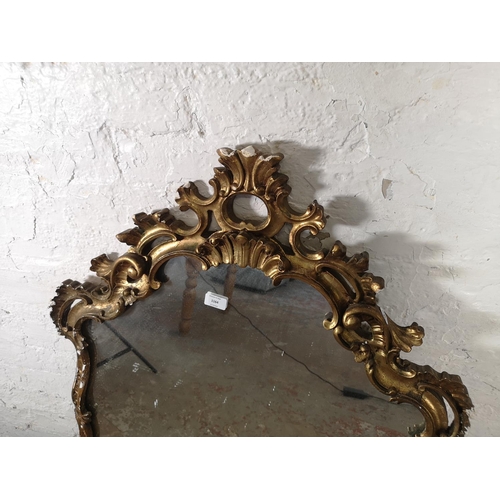 1164 - A Rococo style gilt framed wall hanging mirror - approx. 120cm high x 74cm wide