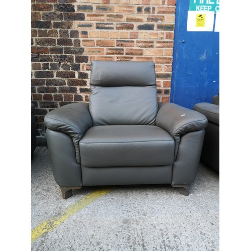 1069 - An ROM grey leather three piece lounge suite comprising two armchairs and two seater sofa