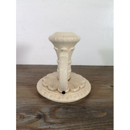 245B - A ceramic candlestick with unknown makers marks to base, provided by the Bossons family - approx. 13... 