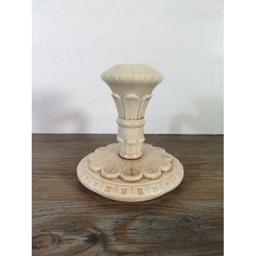 245B - A ceramic candlestick with unknown makers marks to base, provided by the Bossons family - approx. 13... 