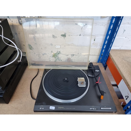 1485 - Two turntables, one Technics SL-B210 two speed and one boxed EnVivo 1333 USB converter