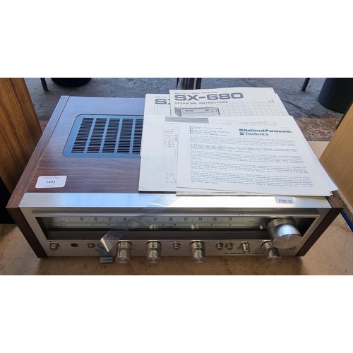 1491 - A Pioneer SX-680 receiver with instruction manuals