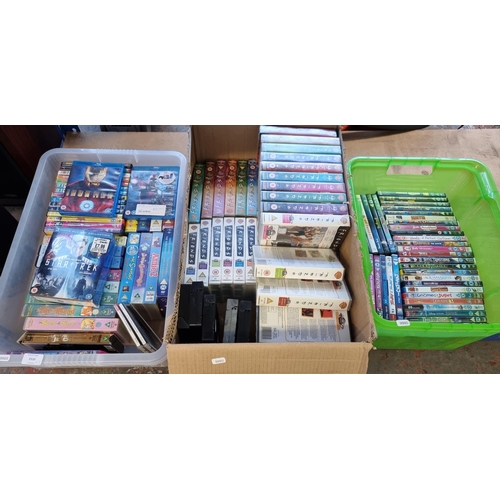 1510 - Three boxes containing a collection of VHS videos, DVDs and Blurays - see images for titles