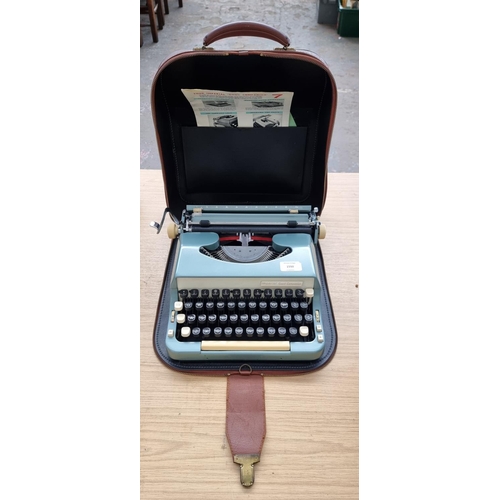 1550 - A cased Imperial Good Companion portable typewriter with instruction manual