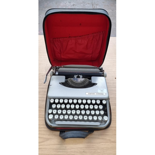 1551 - A cased Empire Corona portable typewriter