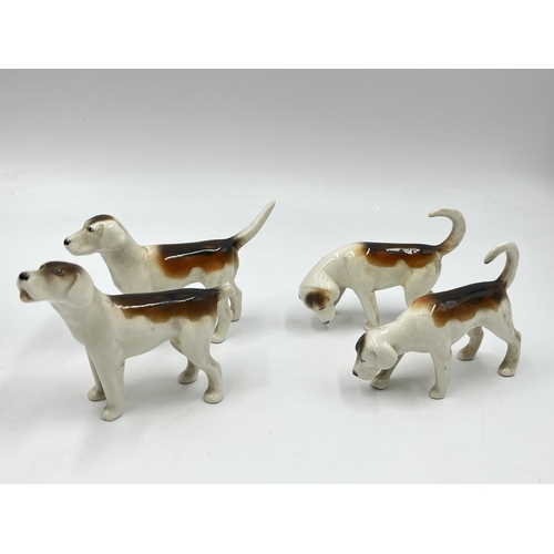 1167 - Five Beswick figurines, one Rearing Huntsman model no. 868 and four hunting hounds