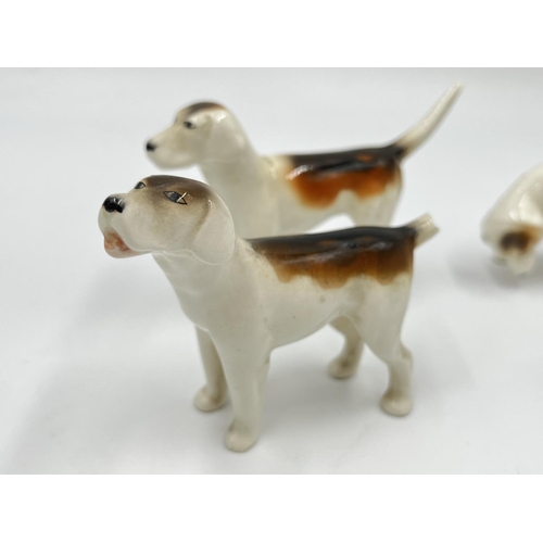 1167 - Five Beswick figurines, one Rearing Huntsman model no. 868 and four hunting hounds