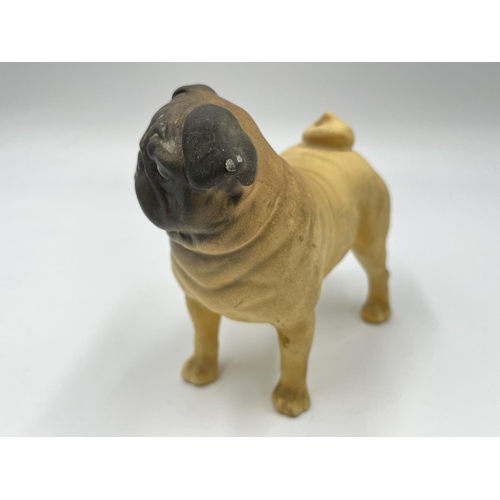 1169 - A Beswick CH. Cutmil Cupie pug figurine - approx. 10.5cm high x 12cm long