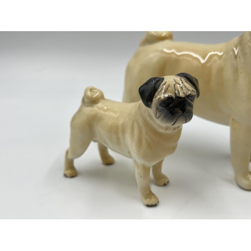 1170 - Two Beswick pug figurines, one being CH. Cutmil Cupie