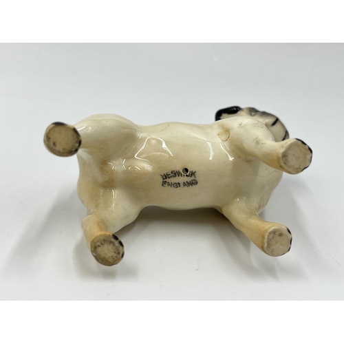 1170 - Two Beswick pug figurines, one being CH. Cutmil Cupie