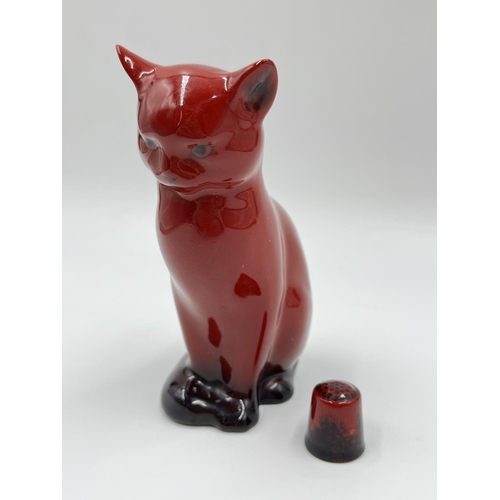 1172 - Two pieces of Royal Doulton Flambé china, one 13cm cat figurine and one thimble