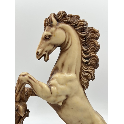 An A. resin horse figurine approx. 35cm high