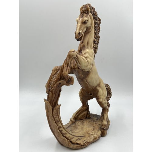 An A. resin horse figurine approx. 35cm high