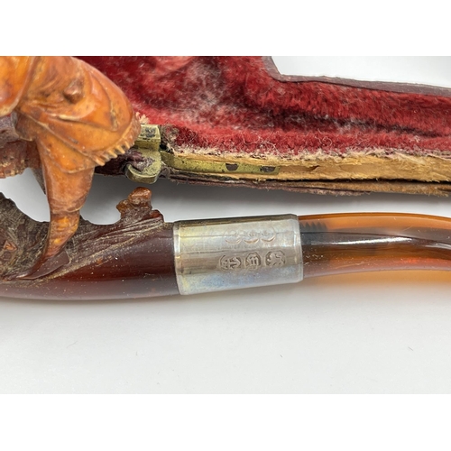 2261 - Three leather cased carved Meerschaum smoking pipes with hallmarked sterling silver collars and ambe... 