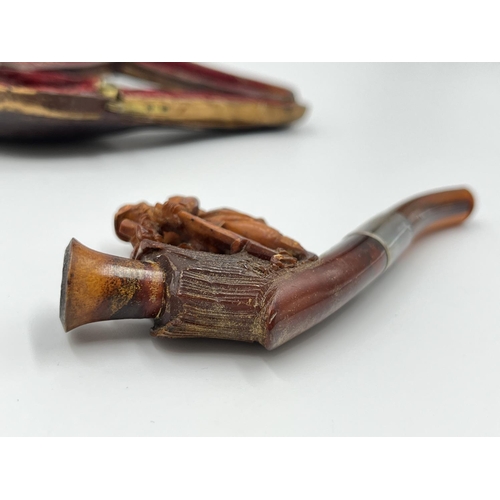 2261 - Three leather cased carved Meerschaum smoking pipes with hallmarked sterling silver collars and ambe... 