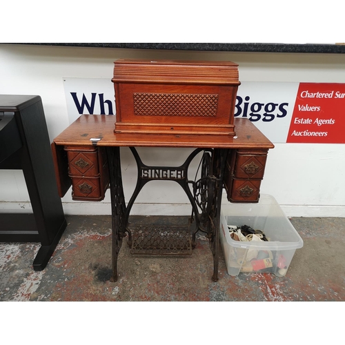 1545 - A 19th century Singer treadle sewing machine - serial no. 15119 637 with accessories