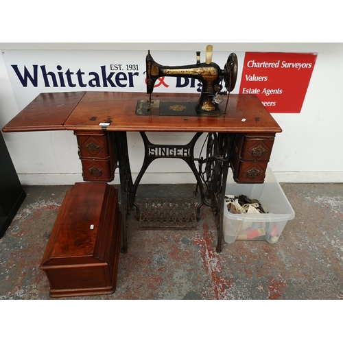 1545 - A 19th century Singer treadle sewing machine - serial no. 15119 637 with accessories