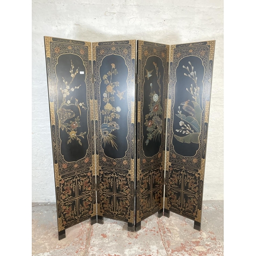 1007A - A black lacquered and hand painted four section folding dressing screen/room divider - approx. 183cm... 