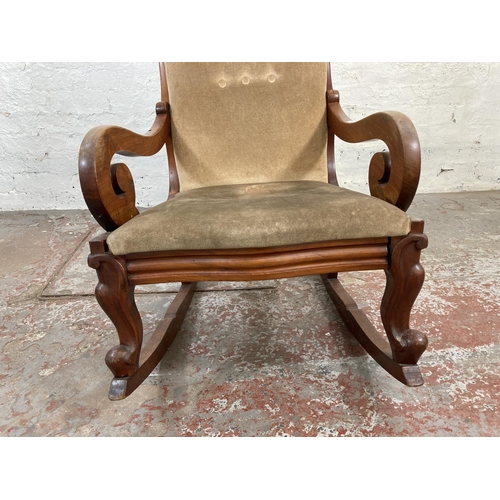 1048A - A late 19th/early 20th century mahogany and beige upholstered rocking chair