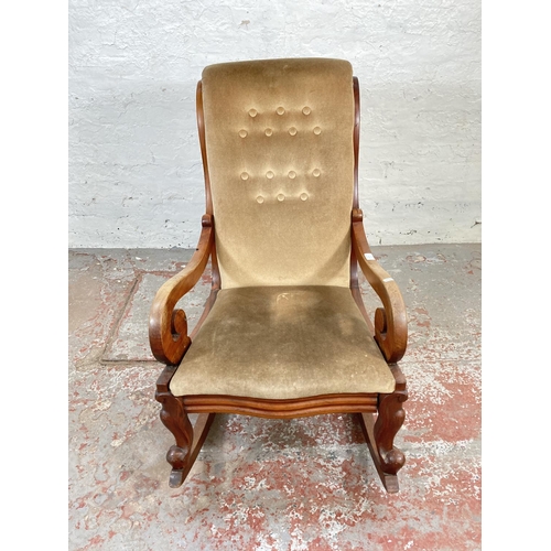 1048A - A late 19th/early 20th century mahogany and beige upholstered rocking chair