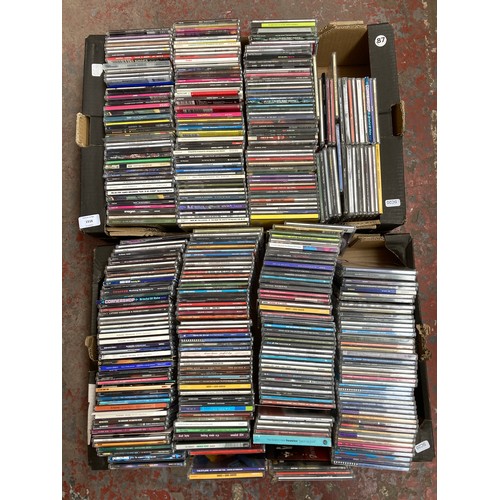 1516 - Two boxes containing a collection of CD singles